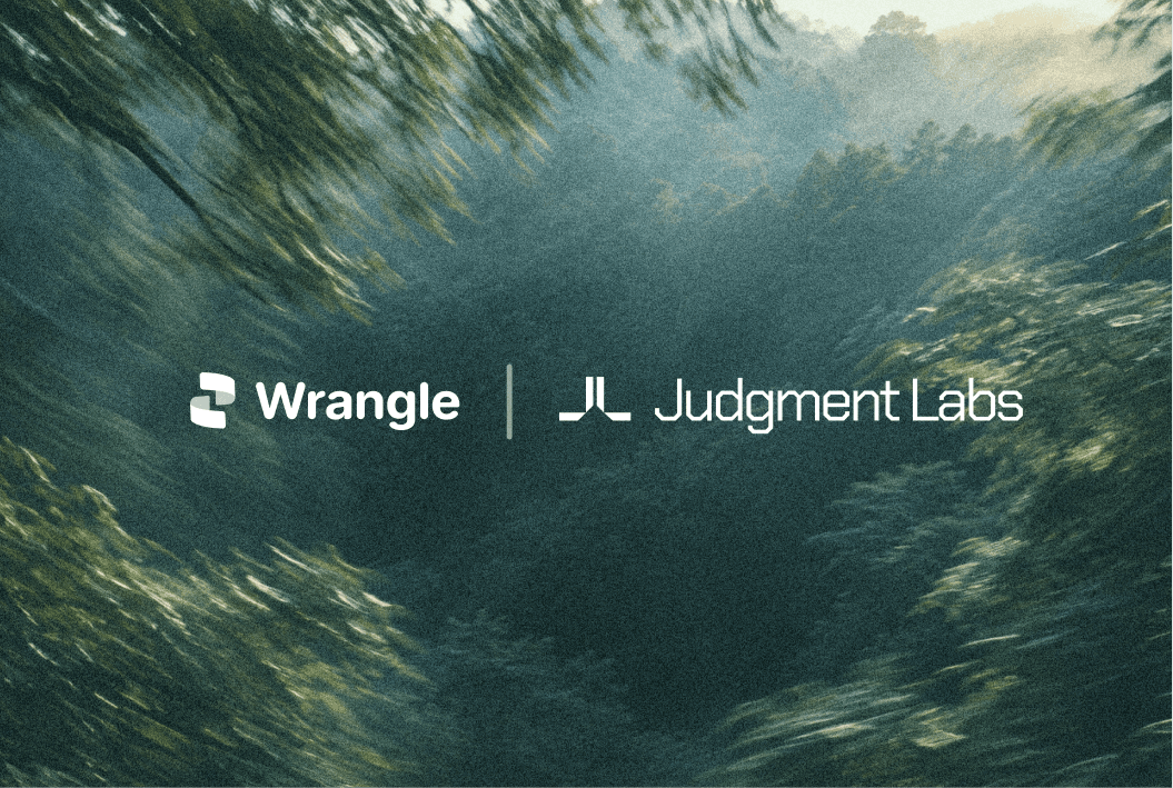 Wrangle and Judgment Labs logos over a sunlit forest canopy.